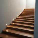 A conceptual image showing a staircase where the steps are incredibly long and flat, illustrating the plateau effect in personal growth. Minimalist design, warm lighting, inspiring atmosphere, high quality.